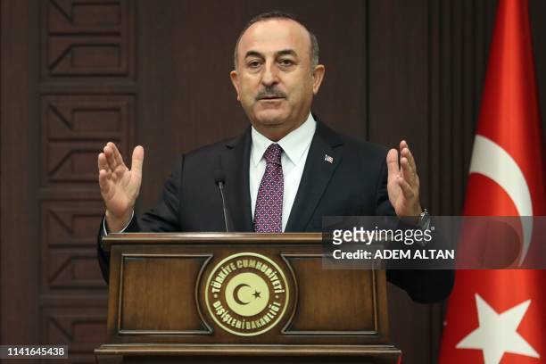 Turkish Foreign Minister Mevlut Cavusoglu gestures as he speaks during a joint press conference with NATO Secretary General at Cankaya Palace in...