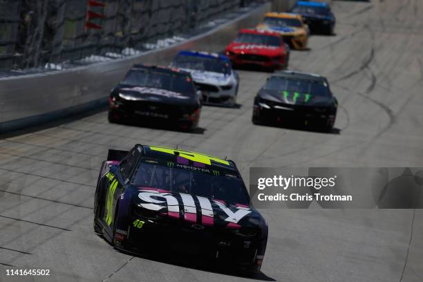 Jimmie Johnson, driver of the Ally Chevrolet, leads a pack of cars during the Monster Energy NASCAR Cup Series Gander RV 400 at Dover International...