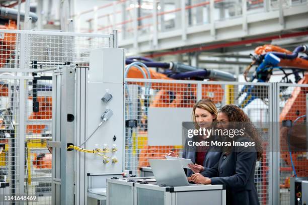 engineers using technologies in auto industry - car sales team stock pictures, royalty-free photos & images