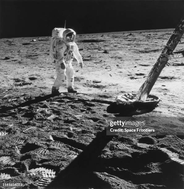 Lunar Module Pilot Edwin 'Buzz' Aldrin Jr near the leg of the Lunar Module the 'Eagle' during his extravehicular activity on NASA's Apollo 11 lunar...