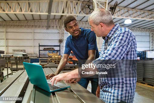 Instructor Trainee Computer Setup Instructor Discussing With Trainee Over Laptop High-Res Stock Photo ...