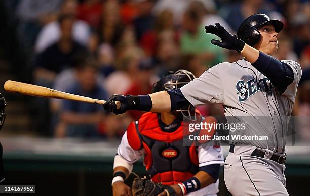 Justin Smoak of the Seattle Mariners watches the ball after hitting a two run home run against the Cleveland Indians during the game on May 13, 2011...