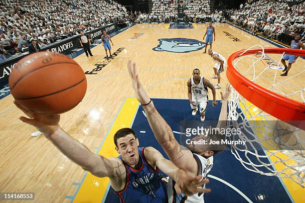 Nick Collison of the Oklahoma City Thunder shoots against Marc Gasol of the Memphis Grizzlies during Game Six of the Western Conference Semifinals in...
