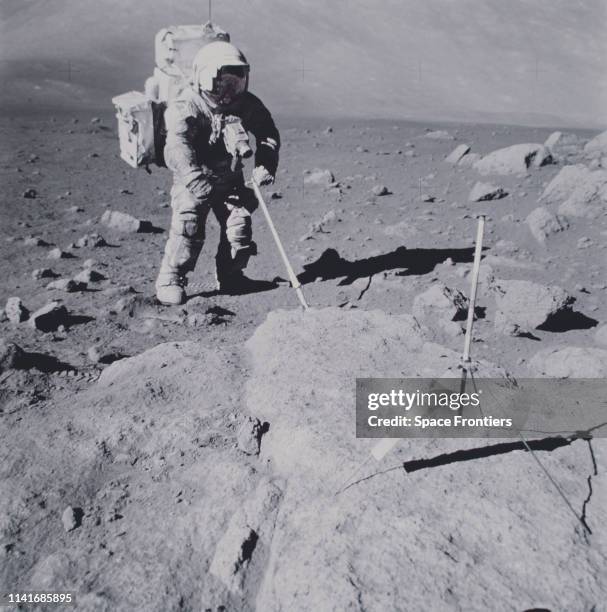 Lunar Module Pilot Harrison H Schmitt collects geological samples on the Moon during his EVA on NASA's Apollo 17 lunar landing mission, 12th December...