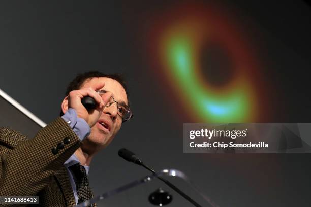 Event Horizon Telescope Director Sheperd Doeleman reveals the first photograph of a black hole during a news conference organized by the National...