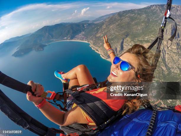 tandem jump in paragliding. - parasailing stock pictures, royalty-free photos & images