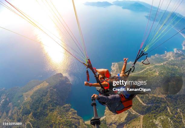 tandem jump in paragliding. - skydiving stock pictures, royalty-free photos & images