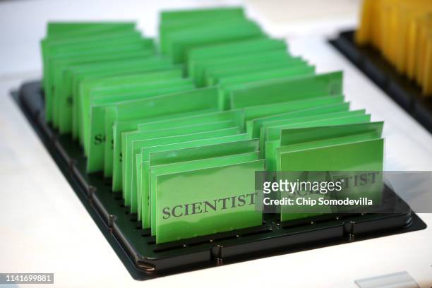 Label tags are ready for scientists to wear while attending a news conference to reveal the first photograph of a black hole at the National Press...