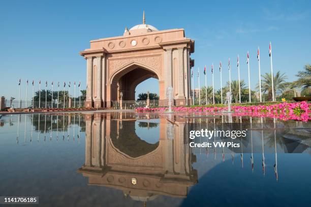 Emirates Palace Abu Dhabi; Dubai; United Arab Emirates - Reflection of archway on water in Abu Dhabi.