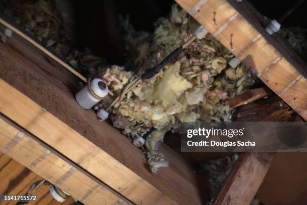 vermiculite type building insulation with asbestos in an old building - asbestos stock pictures, royalty-free photos & images
