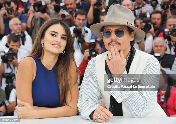Actor Johnny Depp and actress Penelope Cruz attend the "Pirates of the Caribbean: On Stranger Tides" photocall at the Palais des Festivals during the...