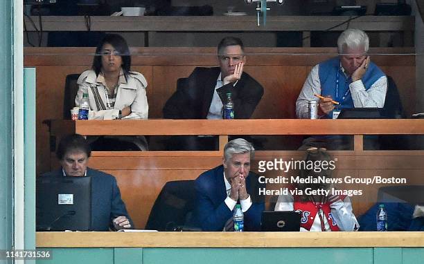 Red Sox president of baseball operations Dave Dombrowski, buttom row, center, looks on during the ninth inning of a Major League Baseball game...
