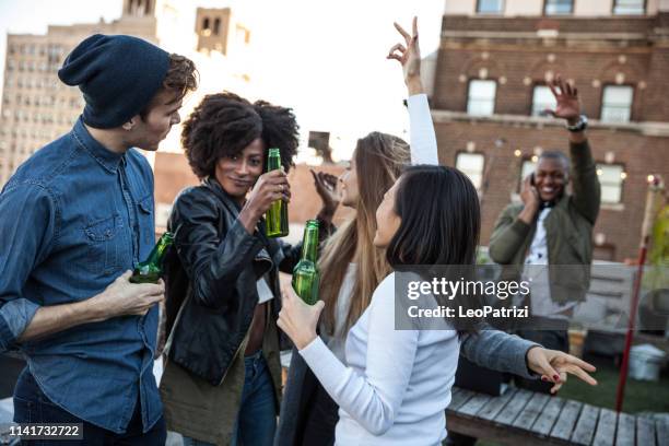 group of friends celebrating in new york summertime - dj summer stock pictures, royalty-free photos & images