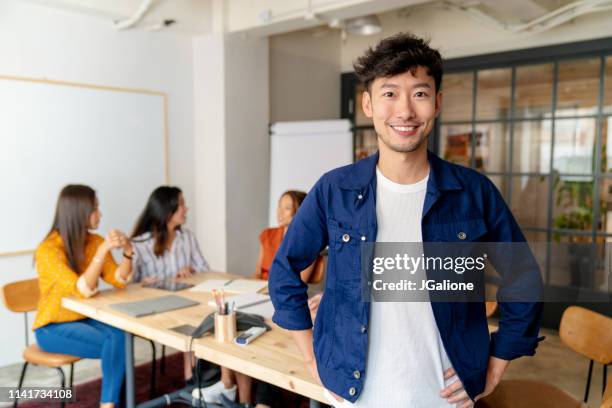 portrait of a young office worker - designing experiences stock pictures, royalty-free photos & images