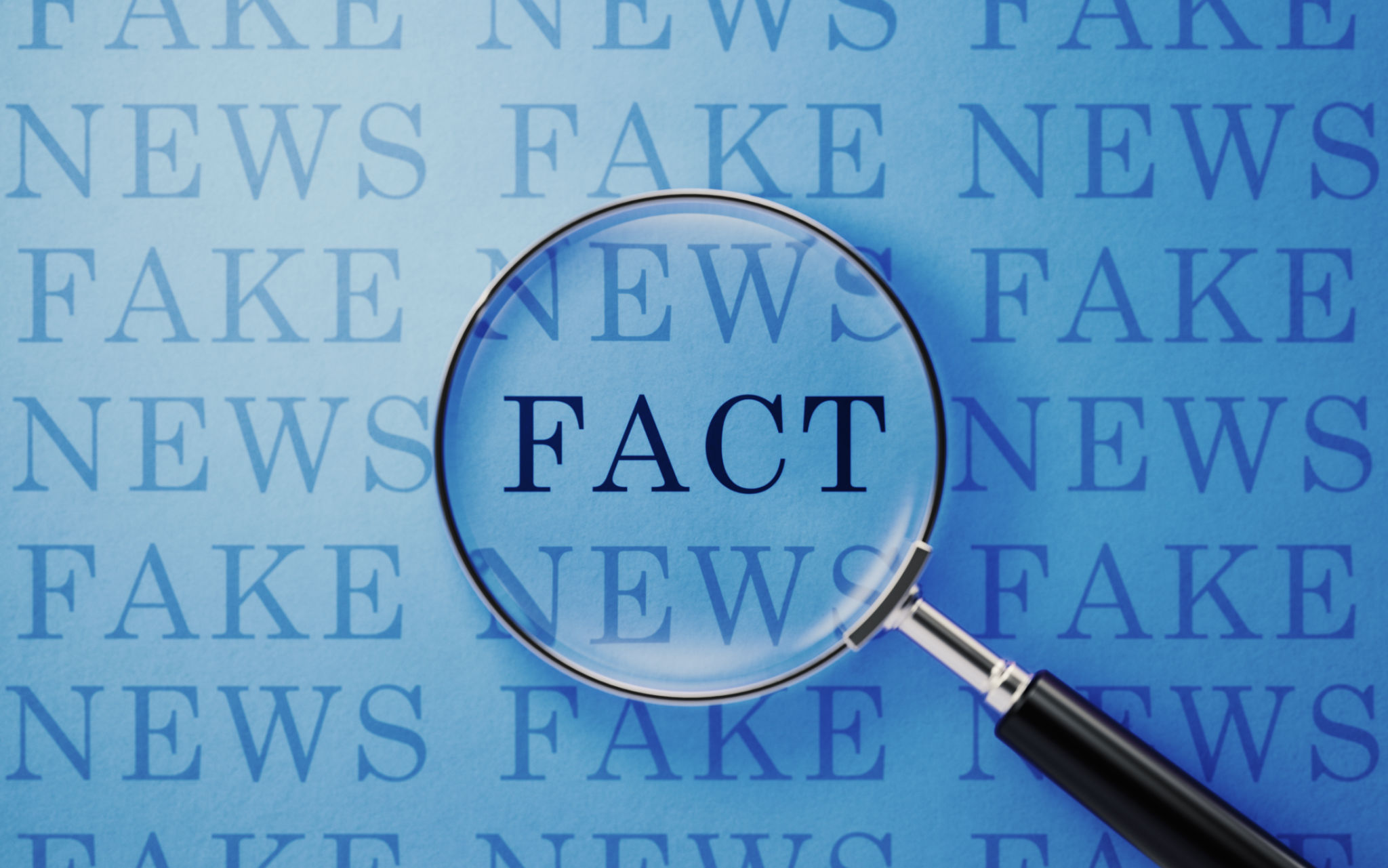 Fake News And Fact Concept - Magnifier And Fake News Text On Blue Background Fake News And Fact Concept - Magnifier And Fake News Text On Blue Background