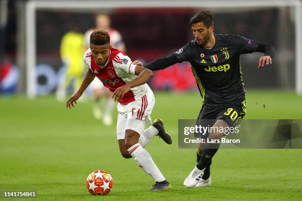 David Neres of Ajax is challenged by Rodrigo Bentancur of Juventus during the UEFA Champions League Quarter Final first leg match between Ajax and...