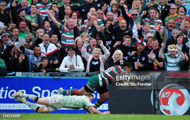 Tigers wing Alesana Tuilagi brushes aside Saints wing Chris Ashton to score during the Aviva Premiership Semi Final between Leicester Tigers and...