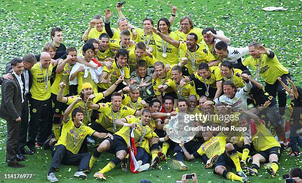 Player of Dortmund celebrate with the trophy winning the German Championship after the Bundesliga match between Borussia Dortmund and Eintracht...