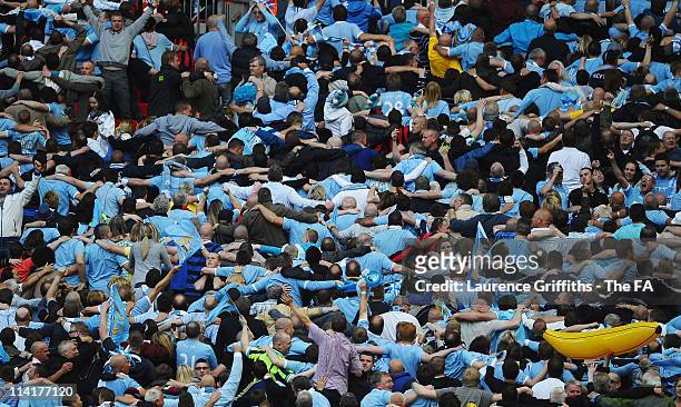 Man City fans do the Poznan celebration during the The FA Cup sponsored by E.0N 2011 Final match between Manchester City and Stoke City at Wembley...