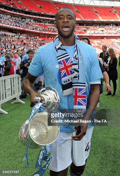 Goal scorer Yaya Toure of Man City celebrates with the cup after the The FA Cup sponsored by E.0N 2011 Final match between Manchester City and Stoke...