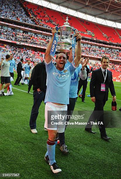 Pablo Zabaleta of Man City lifts the trophy during the The FA Cup sponsored by E.0N 2011 Final match between Manchester City and Stoke City at...