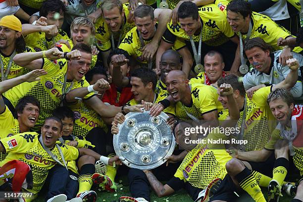 Players of Dortmund celebrate with the trophy winning the German Championship after the Bundesliga match between Borussia Dortmund and Eintracht...