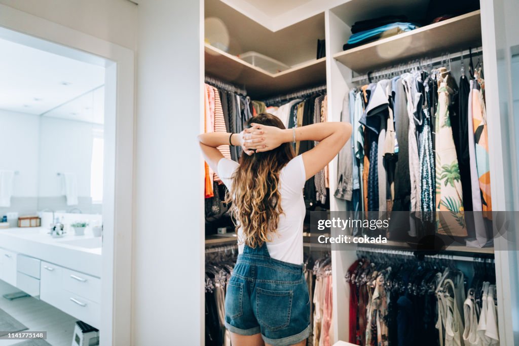 Young teenager girl choosing what to wear