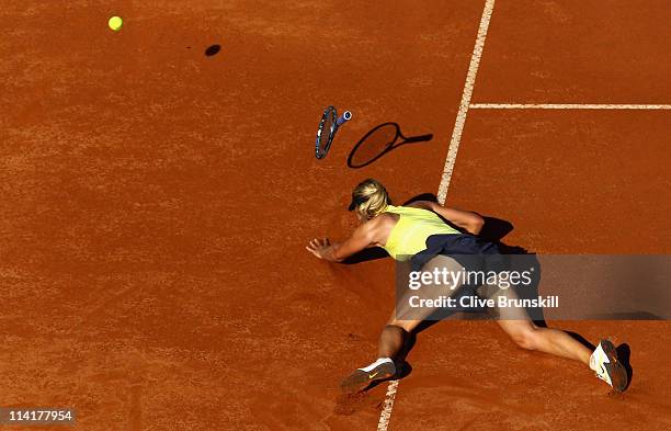 Maria Sharapova of Russia falls during her semi final match against Caroline Wozniacki of Denmark during day seven of the Internazoinali BNL D'Italia...