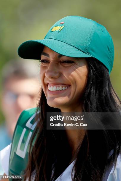 Allison Stokke, fiancee of Rickie Fowler of the United States ,, looks on during the Par 3 Contest prior to the Masters at Augusta National Golf Club...