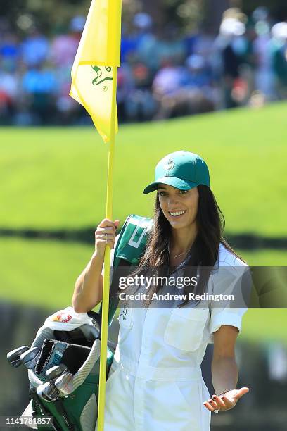 Allison Stokke, fiance of Rickie Fowler ,, reacts on a green during the Par 3 Contest prior to the Masters at Augusta National Golf Club on April 10,...
