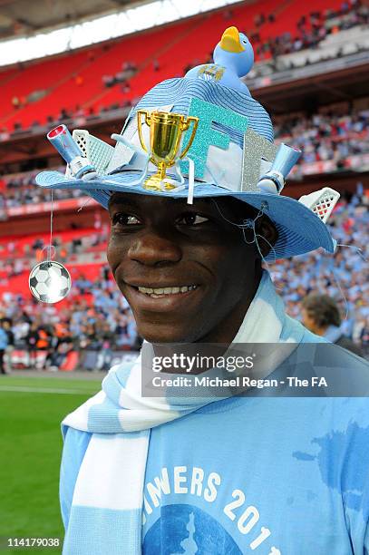 Mario Balotelli of Man City smiles during the The FA Cup sponsored by E.0N 2011 Final match between Manchester City and Stoke City at Wembley Stadium...