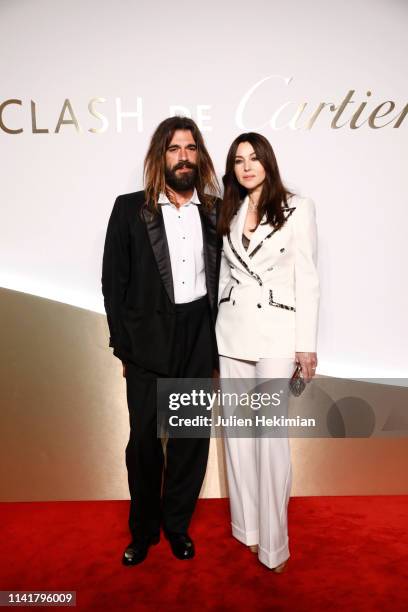 Monica Bellucci and her companion Nicolas Lefebvre attend the "Clash De Cartier" Launch Photocall At La Conciergerie In Paris on April 10, 2019 in...