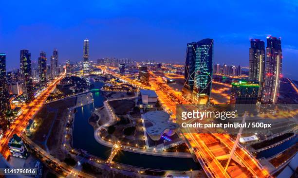 centralpark at night incheon, south korea - songdo ibd stock pictures, royalty-free photos & images