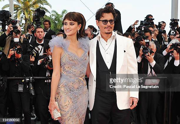 Actors Johnny Depp and Penelope Cruz attend the "Pirates of the Caribbean: On Stranger Tides" premiere at the Palais des Festivals during the 64th...