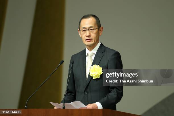 Nobel Prize laureate Shinya Yamanaka addresses during the ceremony marking Emperor Akihito's 30-year anniversary in throne at the National Theatre on...
