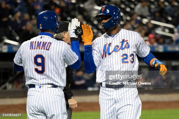 Keon Broxton of the New York Mets celebrates with Brandon Nimmo of the New York Mets after scoring a run in the eighth inning at Citi Field on April...