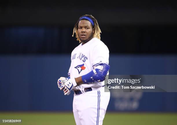 Vladimir Guerrero Jr. #27 of the Toronto Blue Jays reacts after grounding into a double play to end the fourth inning during MLB game action against...