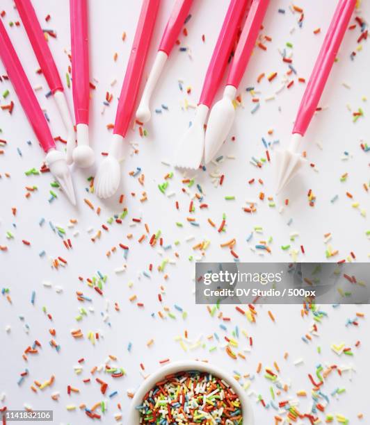 colorful sprinkles and cake decoration tools - hundreds and thousands stock pictures, royalty-free photos & images
