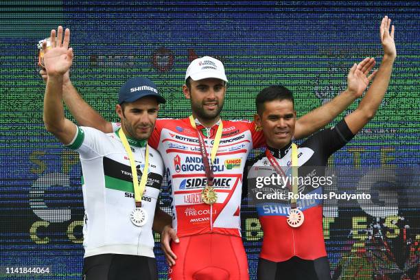 Silver medalist Youcef Reguigui of Terengganu Inc. TSG Cycling Team, gold medalist Matteo Pelucchi of Androni Giocattoli-Sidermec, and bronze...