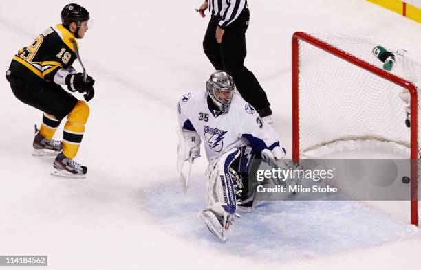 Tyler Seguin of the Boston Bruins scores a goal past Dwayne Roloson of the Tampa Bay Lightning in the first period of Game One of the Eastern...