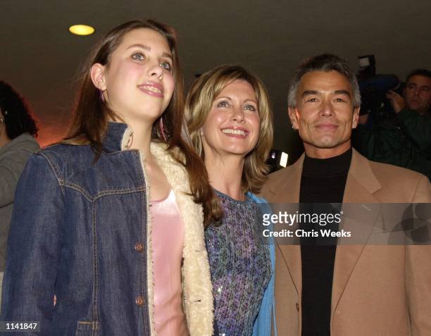 Actress Olivia Newton John, center, daughter Chloe, left, and boyfriend Patrick McDermott, right, arrive at the Los Angeles opening of "Mamma Mia!"...