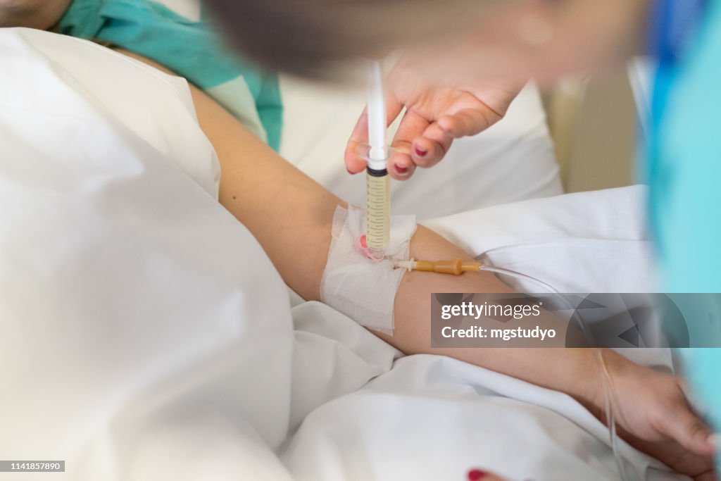 Injections Post Operative Nurse Doing Injection To Patient After Surgery High-Res Stock Photo ...