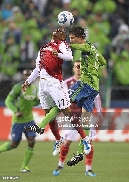 Alvaro Fernandez of the Seattle Sounders FC battles Jeremy Hall of the Portland Timbers at Qwest Field on May 14, 2011 in Seattle, Washington.