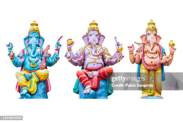 figurine of lord ganesha on white background - ganesha stock pictures, royalty-free photos & images