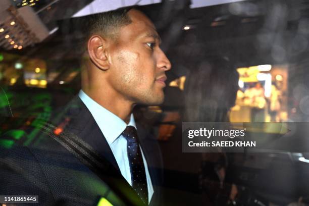 Australia's full-back Israel Folau leaves after a code of conduct hearing in Sydney on May 7, 2019. - NSW Waratahs chairman Roger Davis on May 7...