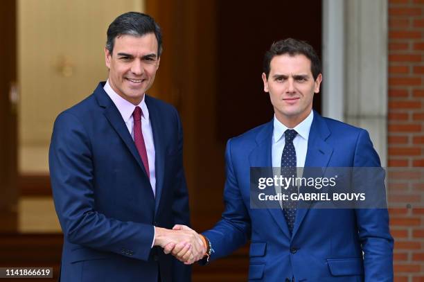 Spanish prime minister Pedro Sanchez shakes hands with the leader of Ciudadanos party Albert Rivera prior to holding a meeting at La Moncloa Palace...