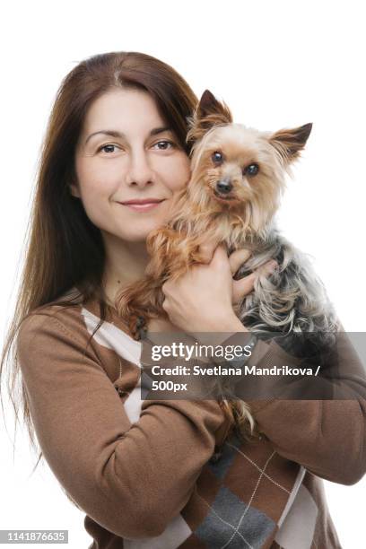 happy dog and owner - yorkshire terrier vet stock pictures, royalty-free photos & images