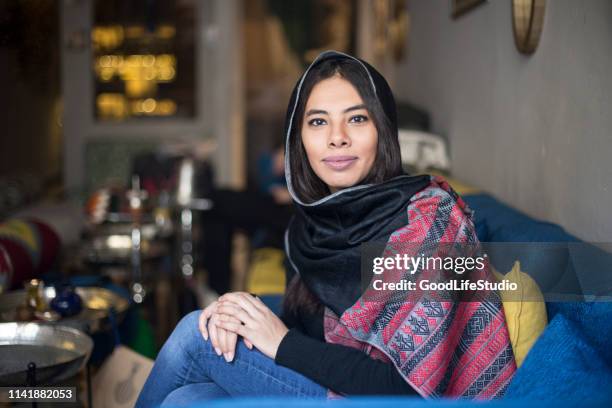 young arab woman in a bar - egyptian stock pictures, royalty-free photos & images