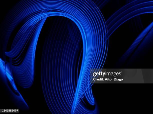 industrial and processes innovation.  wavy neon lights in a futuristic environment - modern quantum mechanics stock pictures, royalty-free photos & images