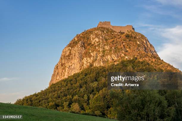 Ruins of the medieval Chateau de Montsegur castle on hilltop at sunset, stronghold of the Cathars in the Ariege department, Occitanie, France.